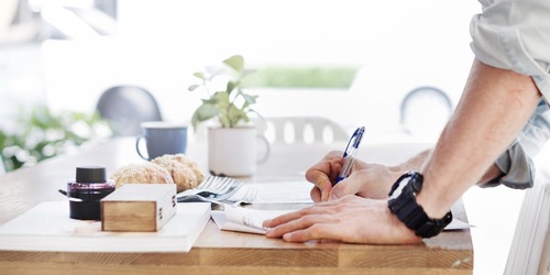 Filling out forms on a desk.